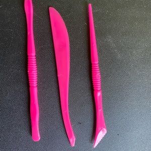 Small pink clay cutters. Used.